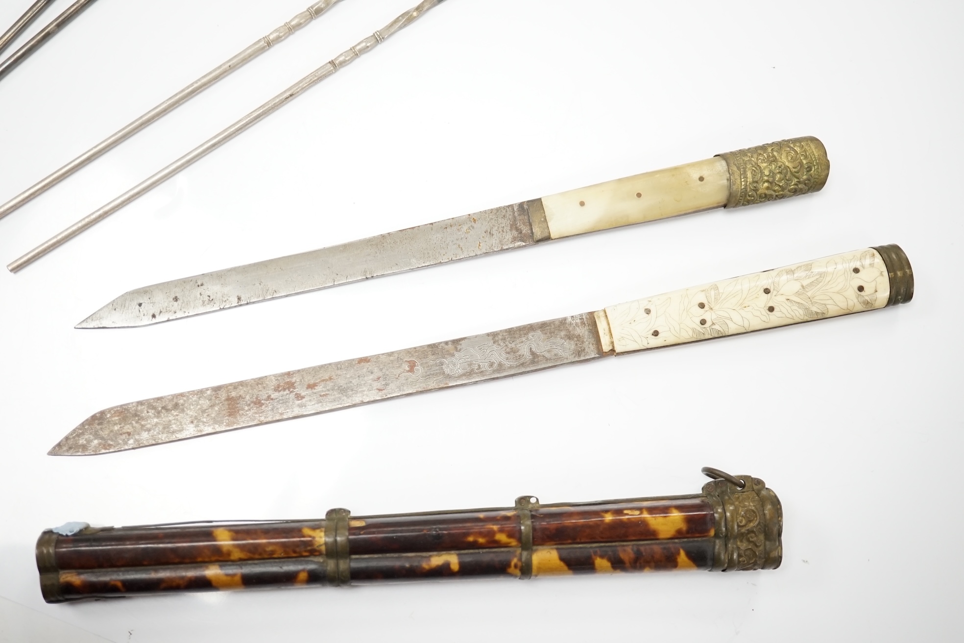 Two Chinese silver chopstick and steel bladed knife sets, one with carved bone handle and tortoiseshell case, largest 34cm in length. Condition - fair to good